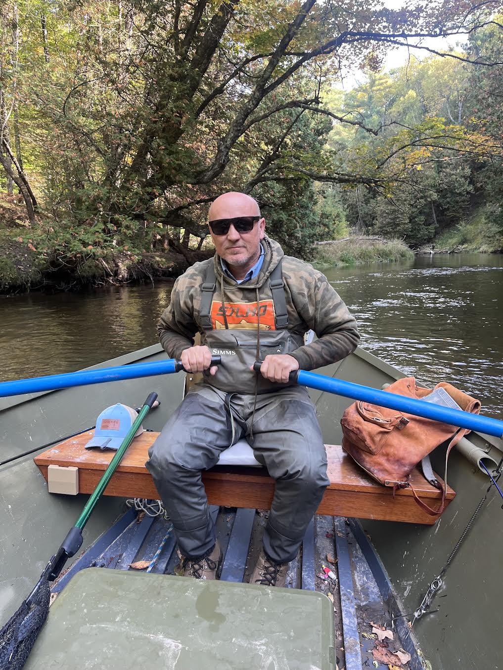 Your guide at the oars of his wooden drift boat on the Pere Marquette River